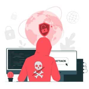 Un hacker avec un pull rouge vu de dos devant son ordinateur